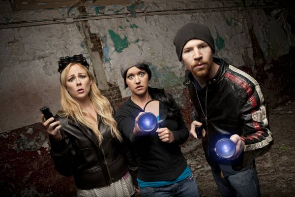 Three people investigate a haunted building, Ghost Tours in Fredericksburg, TX