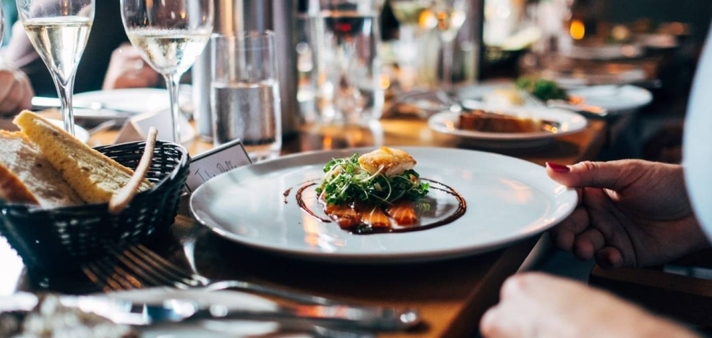 an arugula salad on a white plate at a fredericksburg texas restaurant