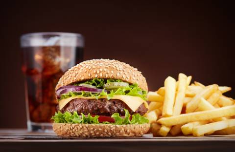 a quarter-pound cheeseburger with fries and cola.