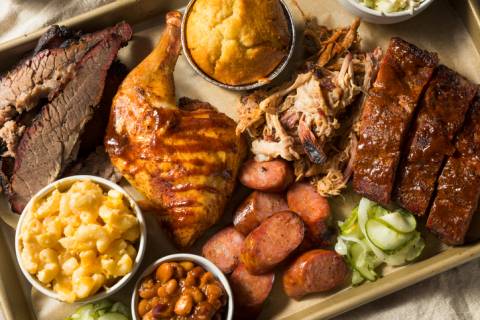 Barbecue a barbecue plate - brisket, chicken, sausage, cornbread, pulled pork and sides