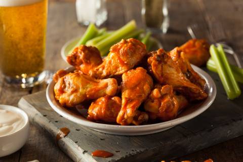Bar food a plate with buffalo wings and celery